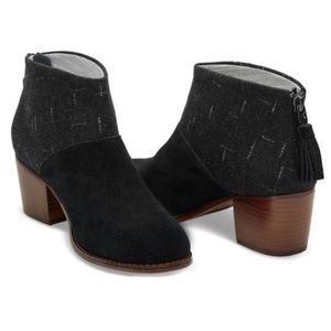 Tom’s black booties